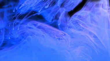 Blue ink splash. Blue ink splash in water on black background