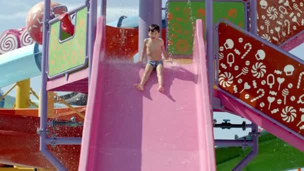 Boy Having Fun Water Slides Aqua Park Glides Funny Ride — Stock Video