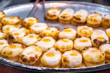 Egg buns are selling in the Myeongdong night market, Seoul, South Korea.