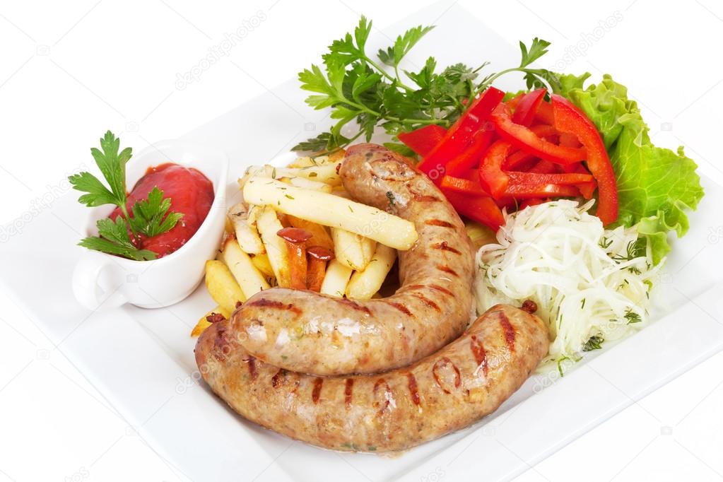 Grilled sausages with French fries, sauerkraut and sweet pepper