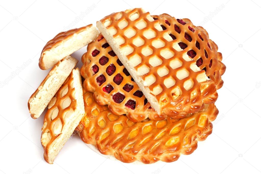 several pies lattice with cheese, jam and lemon on