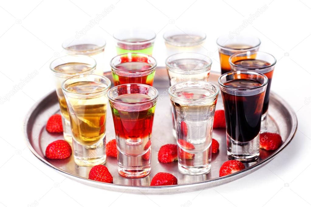 set of short cocktail with raspberries and strawberries on a tray