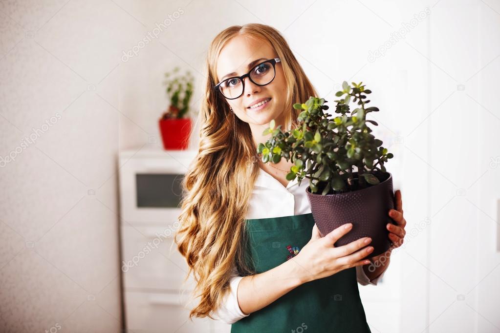 girl with a money Tree is at home