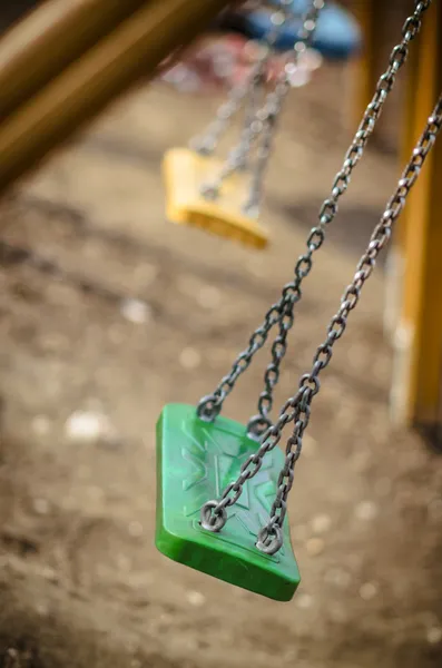 Chain swings falling down in the playground, autumn, fall playgr — Stock Photo, Image