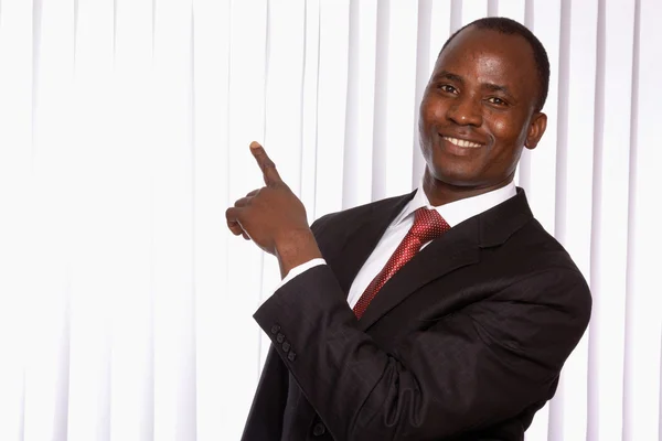 African american businessman pointing at something — Stock Photo, Image