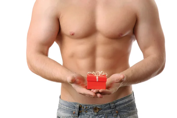 Muscular man with gift — Stock Photo, Image