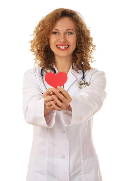 Female doctor with stethoscope holding heart — Stock Photo, Image