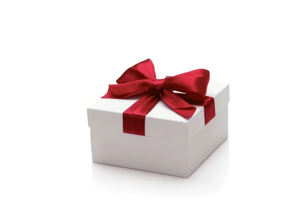 Gift with red ribbons — Stock Photo, Image