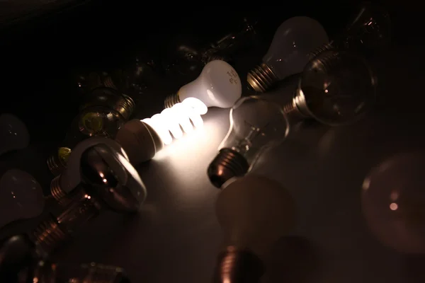 Bright light bulb among others — Stock Photo, Image