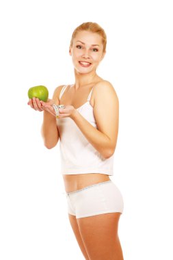 Yeşil elma ve ölçü bandı ile kadın