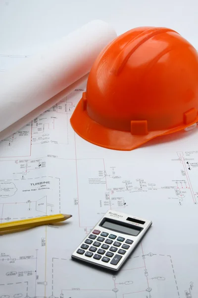 Hard hat, a pencil and calculator — Stock Photo, Image