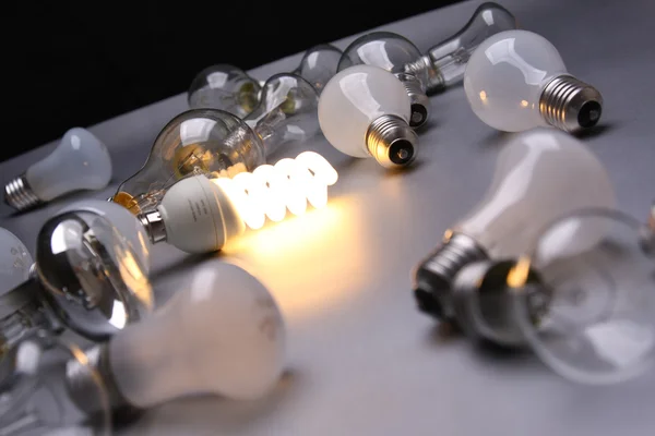 An energy-saving bulb among others — Stock Photo, Image