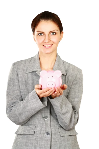 Frau steht mit Sparschwein — Stockfoto