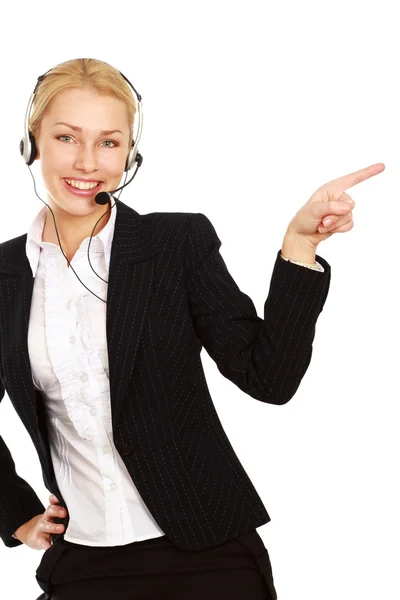 Customer support phone operator in headset pointing — Stock Photo, Image