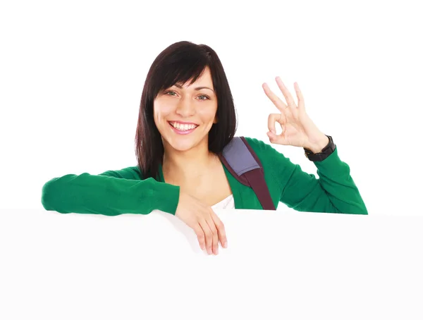 Girl with a blank and showing ok — Stock Photo, Image