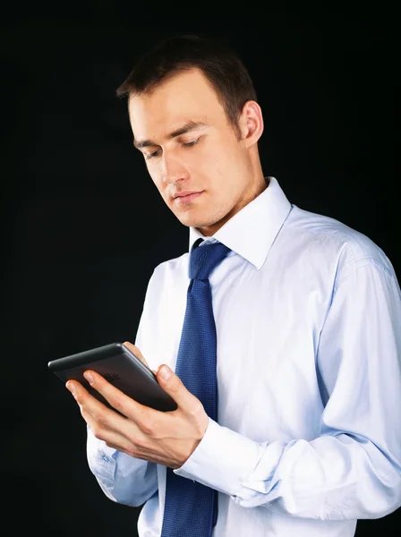 Young adult working on a digital tablet — Stock Photo, Image