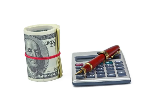 Калькулятор, доллары и ручка — стоковое фото
