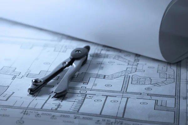 Engineer's work table with drawings and tools of the trade — Stock Photo, Image