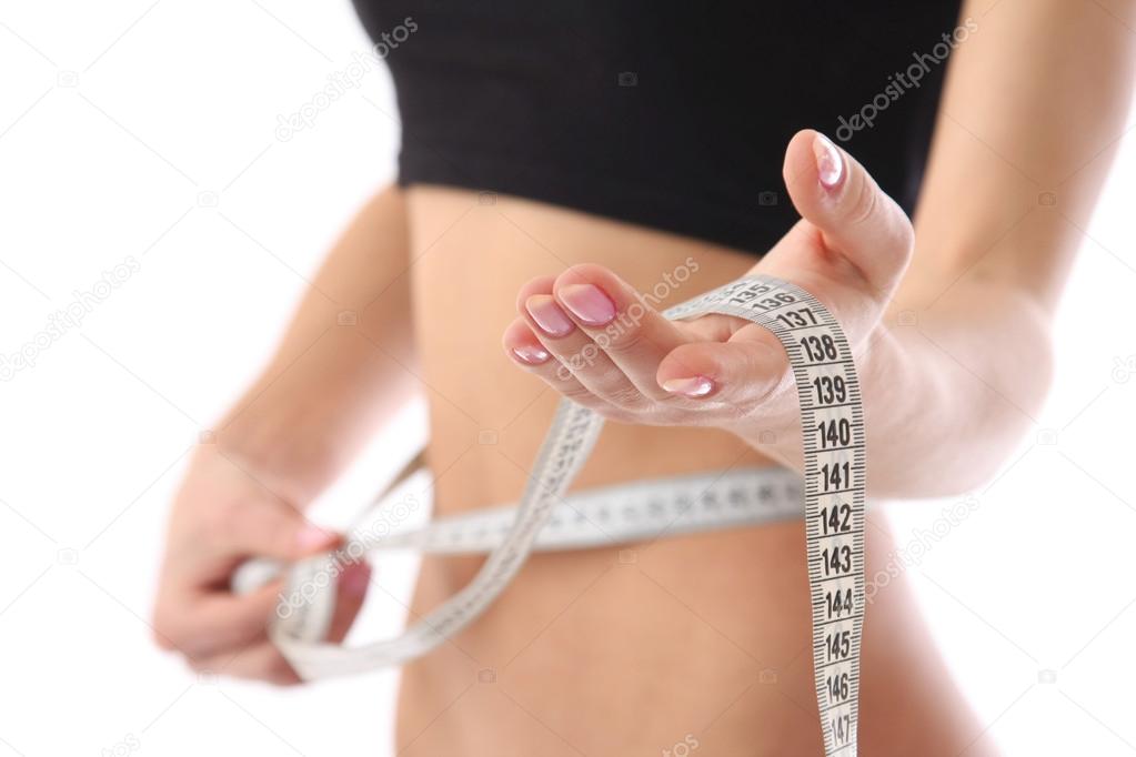 Measure tape around slim beautiful waist.