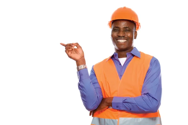 Afrikanischer amerikanischer Bauarbeiter zeigt auf — Stockfoto