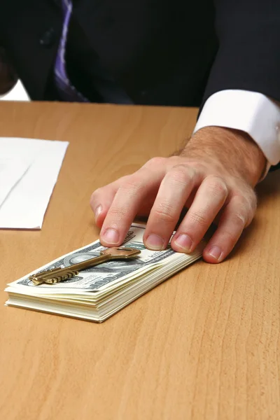 Businessman holds money in a hand — Stock Photo, Image