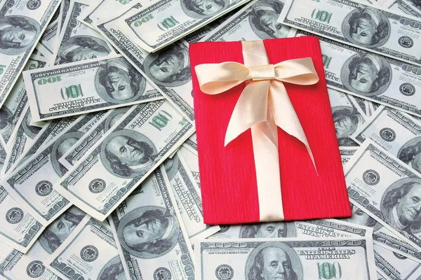 Gift on dollars background — Stock Photo, Image