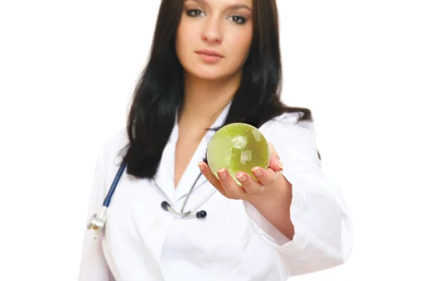 Female doctor a glass globe in her hand — Stock Photo, Image