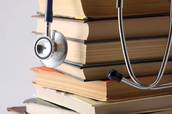 Stethoscope on a pile of books — Stock Photo, Image