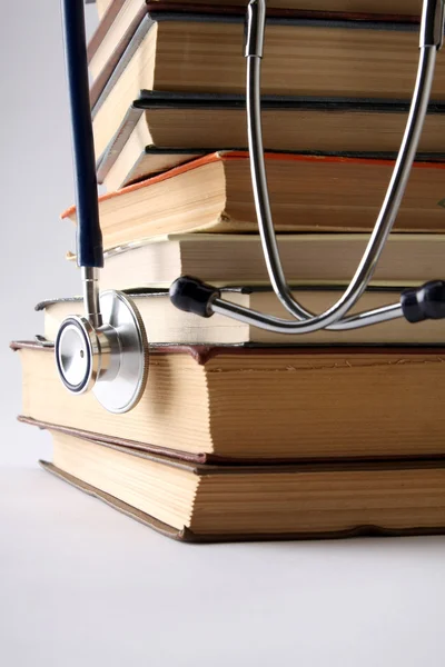 Stethoscope on a pile of books — Stock Photo, Image