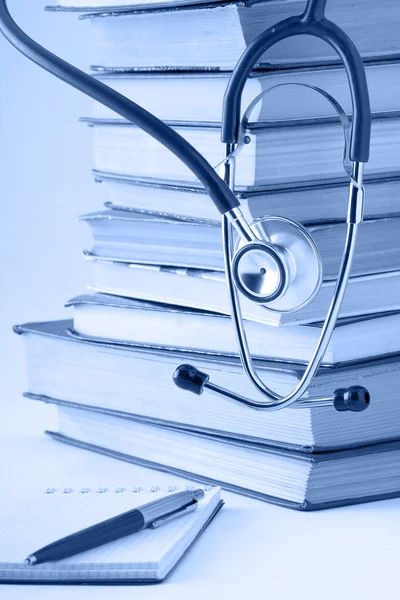 Stethoscope on a pile of books — Stock Photo, Image