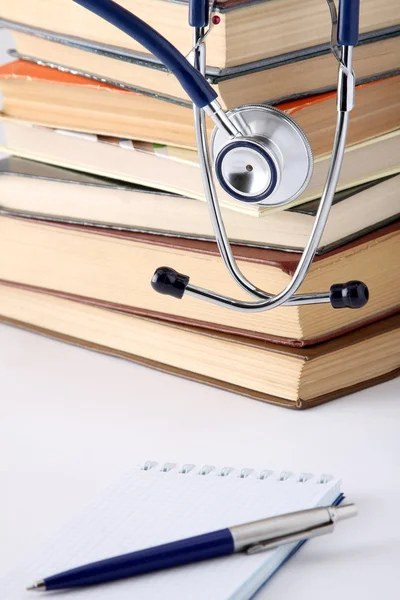 Stethoscope on a pile of books — Stock Photo, Image