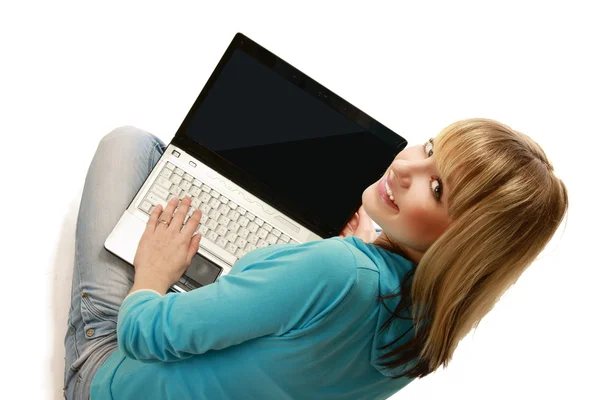 Woman with a laptop sitting on the floor — Stock Photo, Image