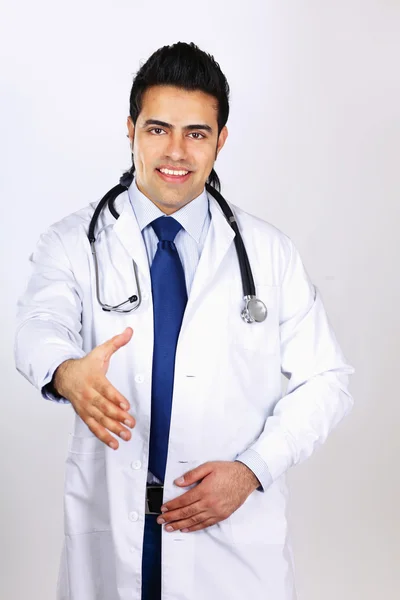 Male doctor giving his hand for a handshake — Stock Photo, Image