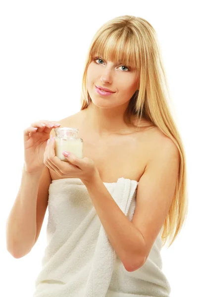 Woman holding a bottle of cream — Stock Photo, Image