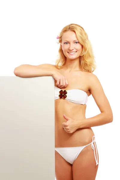 Mujer en traje de baño con un blanco, mostrando ok — Foto de Stock