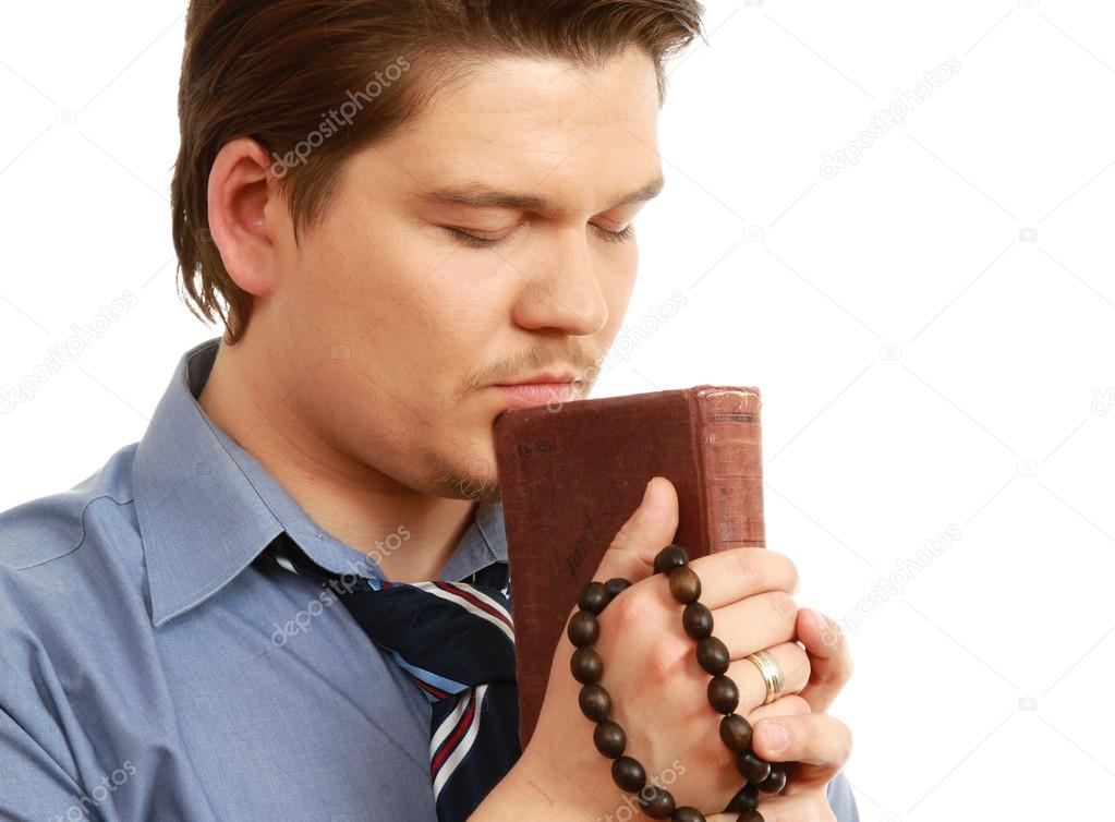 Young businessman praying