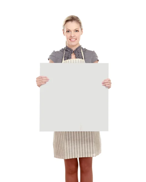 Woman in apron holding sign billboard — Stock Photo, Image