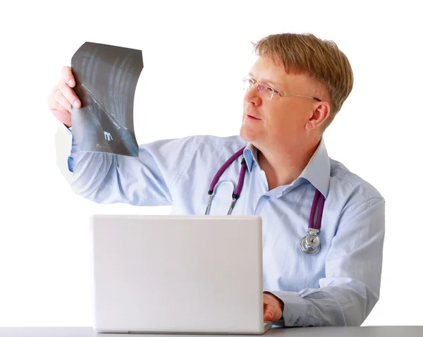 Male doctor examining x-ray — Stock Photo, Image