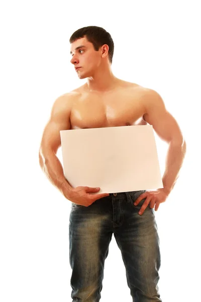 Muscular man with a blank — Stock Photo, Image