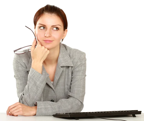 Businesswoman sitting on the desk — Stock Photo, Image