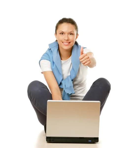 Woman with laptop and showing thumb up — Stock Photo, Image