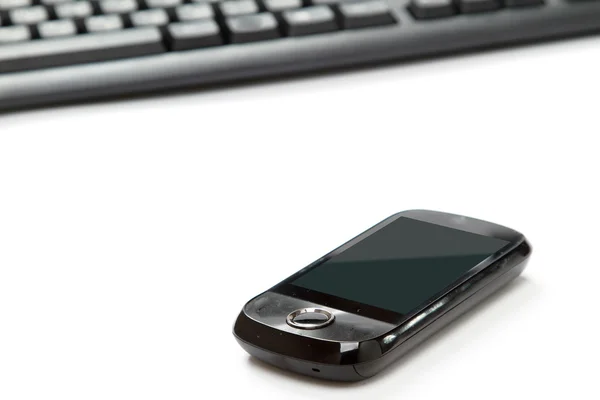 Mobile phone near laptop — Stock Photo, Image