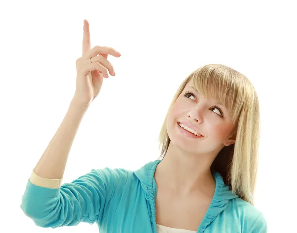 Mujer joven sonriente señalando hacia arriba — Foto de Stock