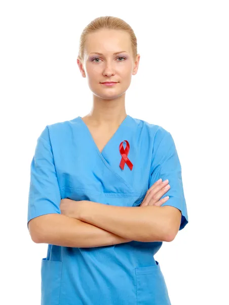 Female doctor holding red ribbon — Stock Photo, Image