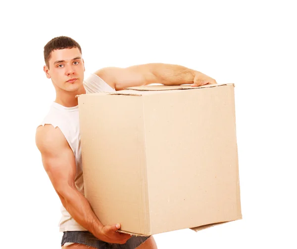Young guy carrying a box — Stock Photo, Image
