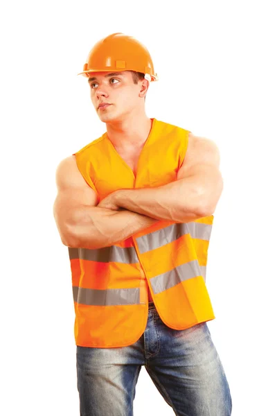 Muscular worker standing with folded arms — Stock Photo, Image