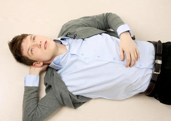 Guy lying on the floor — Stock Photo, Image