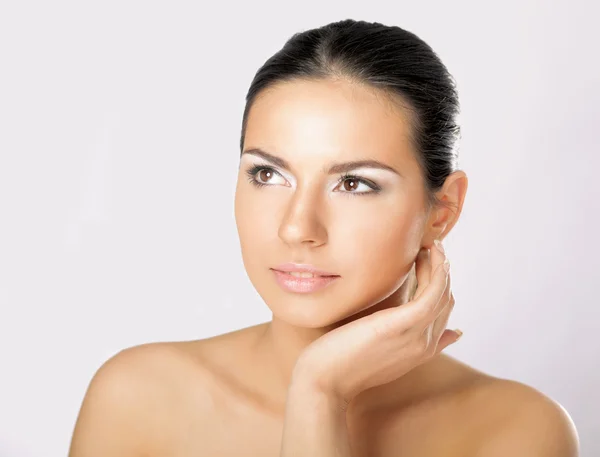 Woman touching her face — Stock Photo, Image