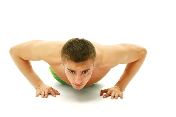 Young man making push-ups — Stock Photo, Image
