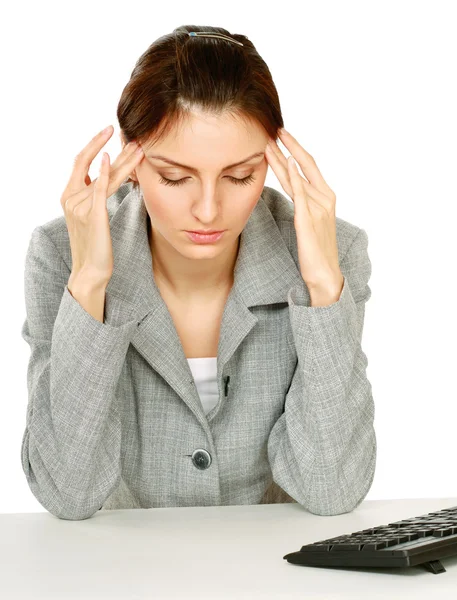 Moe vrouw zitten op het Bureau Rechtenvrije Stockafbeeldingen